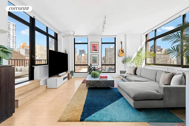a living room with furniture and a potted plant