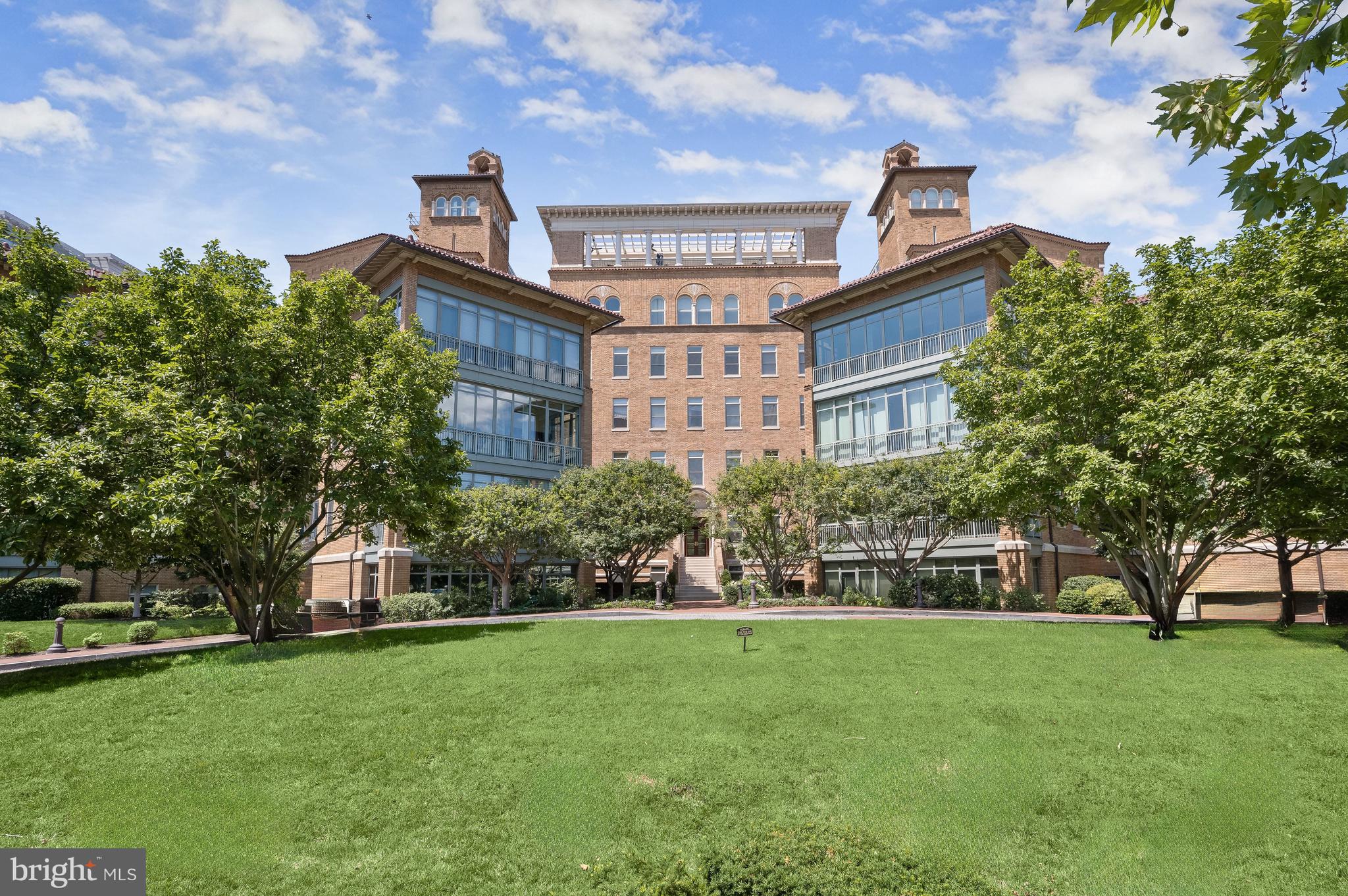 2425 L Street Northwest, Unit 709 Washington, DC 20037 - Photo 23 of 24 a front view of a house with a garden