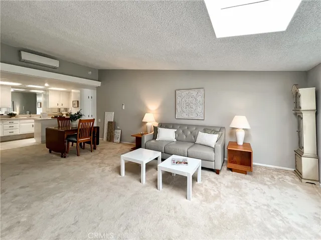 a living room with furniture and a lamp