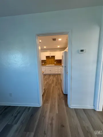 a kitchen with granite countertop a stove and a sink