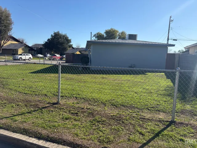 a view of yard with swimming pool and outdoor seating
