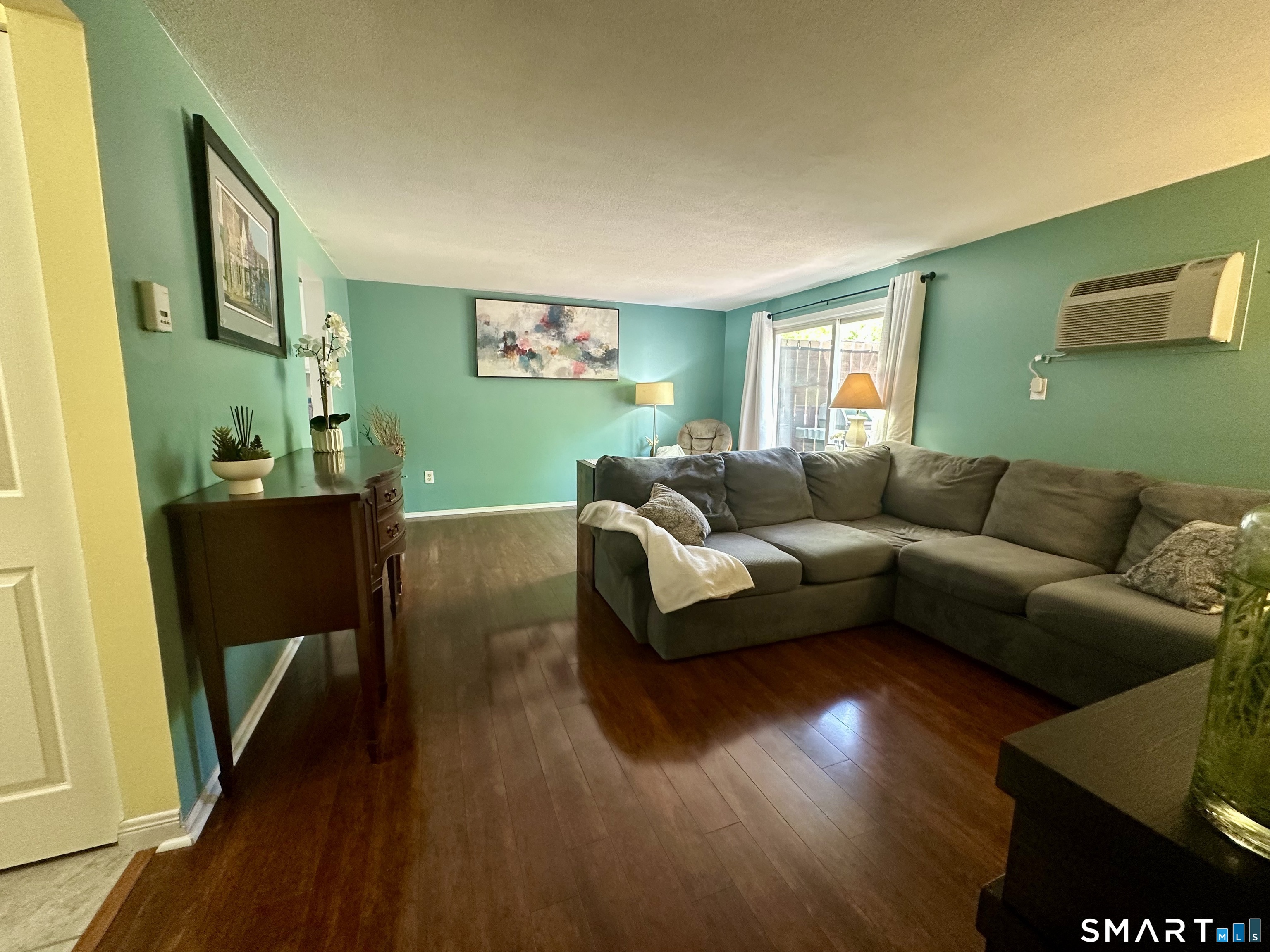 2 Lakeside Drive, Unit M Ledyard, CT 06339 - Photo 12 of 38 a living room with furniture and a flat screen tv