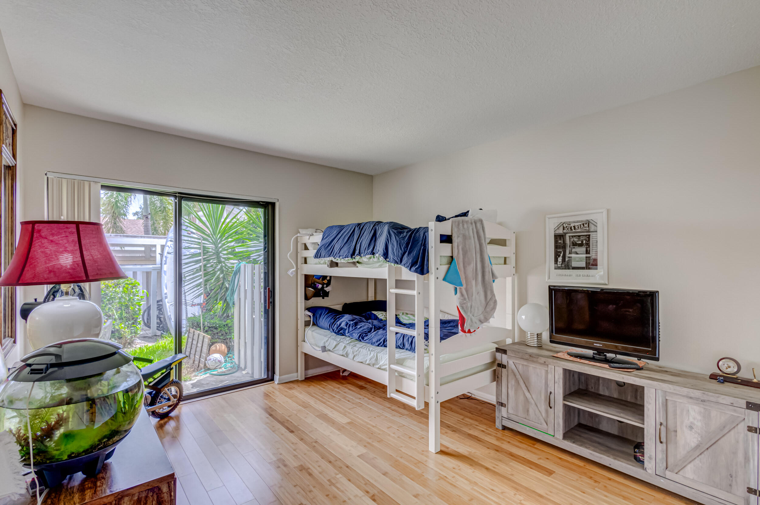 3793 Cape Pointe Circle Jupiter, FL 33477 - Photo 15 of 20 a bedroom with furniture and a flat screen tv