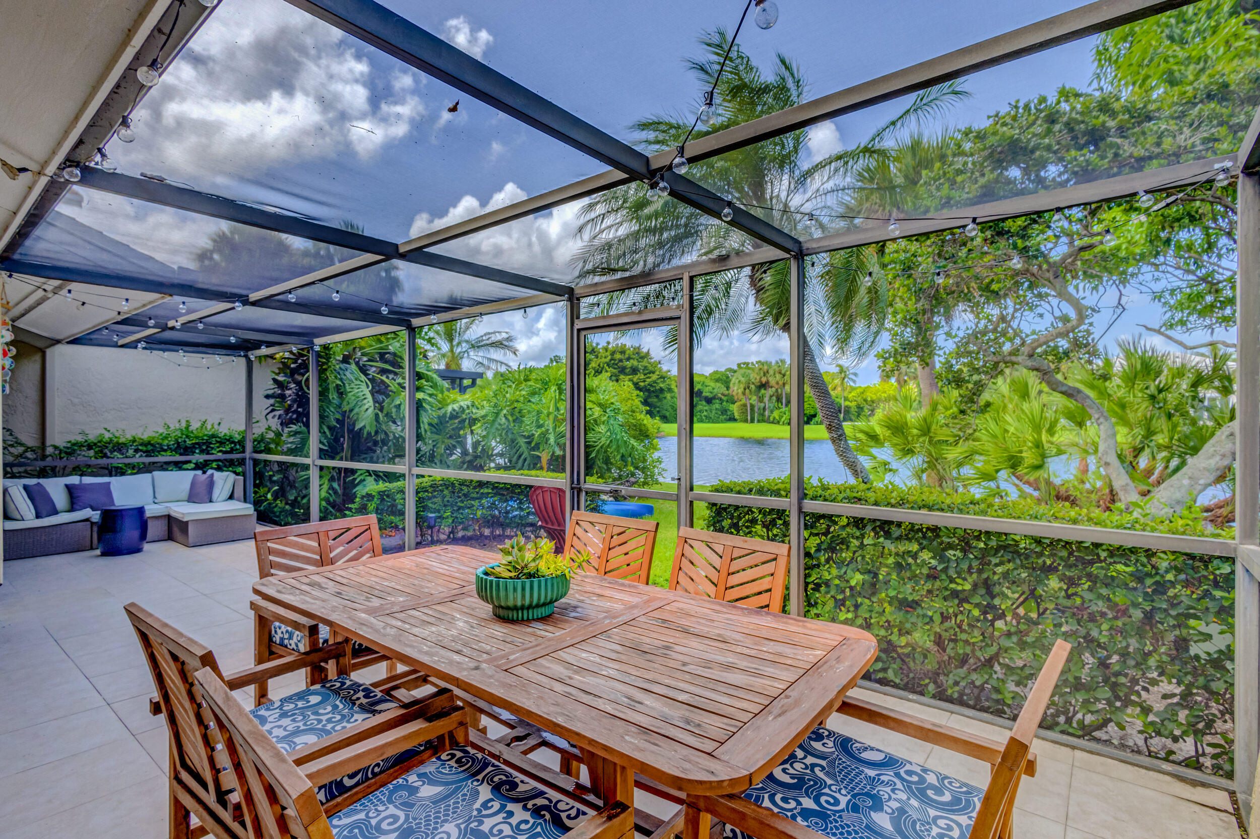 3793 Cape Pointe Circle Jupiter, FL 33477 - Photo 19 of 20 a view of a chairs and table in the patio