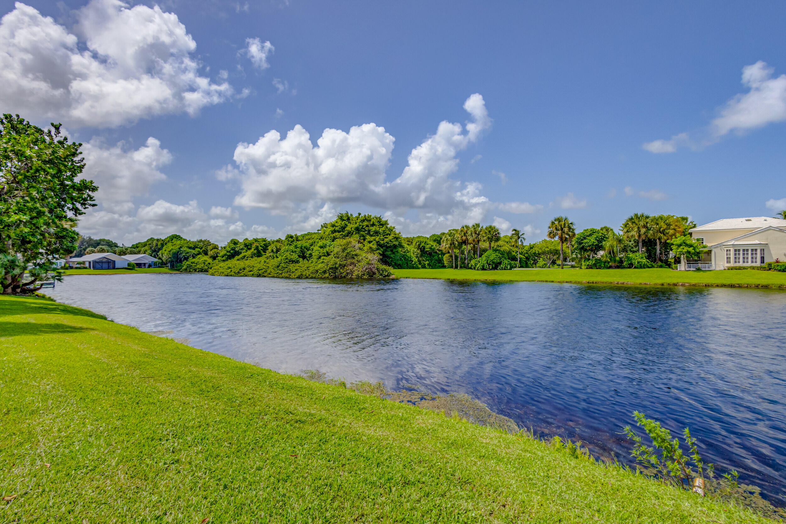 3793 Cape Pointe Circle Jupiter, FL 33477 - Photo 20 of 20 a view of a lake with houses in the back