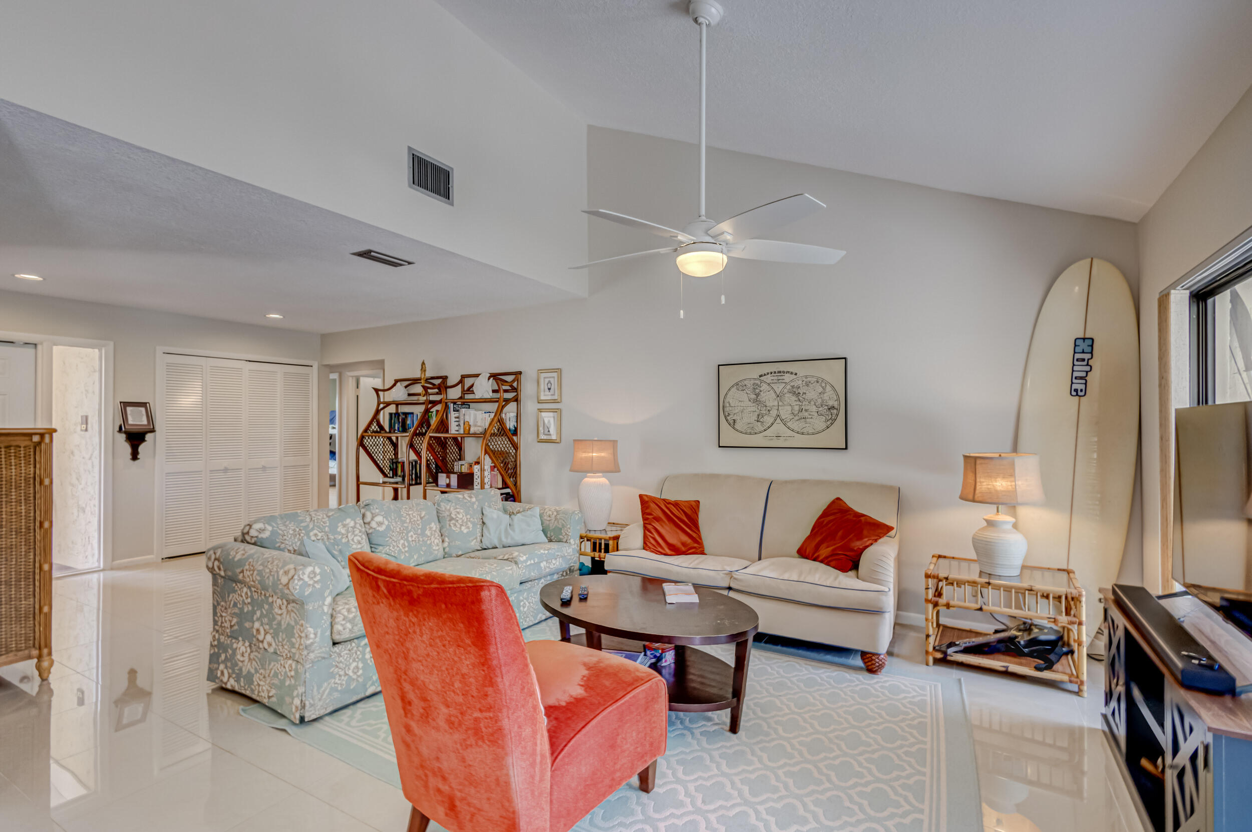 3793 Cape Pointe Circle Jupiter, FL 33477 - Photo 4 of 20 a living room with furniture and a flat screen tv