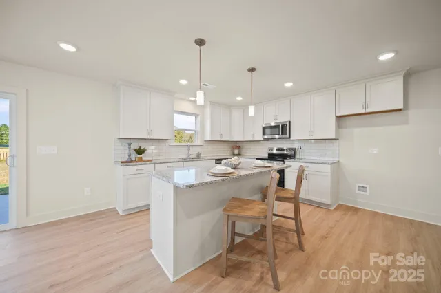 a kitchen with a sink a counter top space and appliances