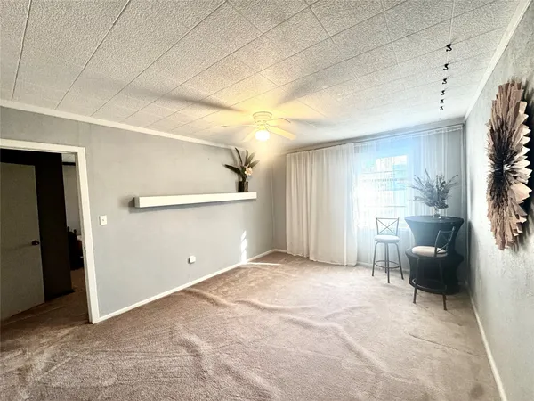 a view of livingroom with furniture and windows