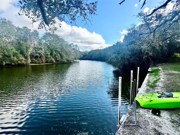a view of a lake with a yard