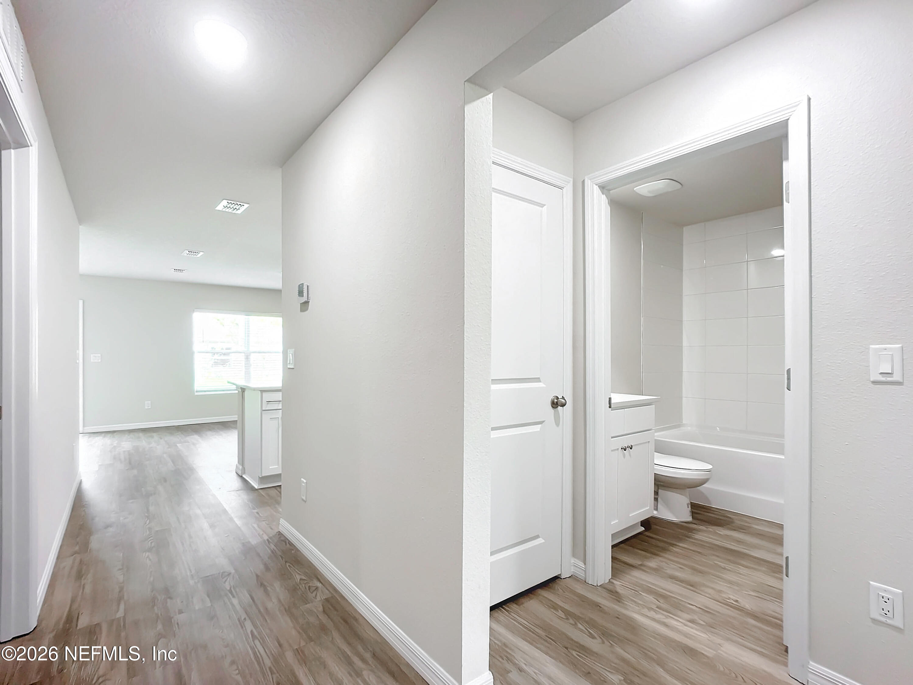 66 Rickenbacker Drive Palm Coast, FL 32164 - Photo 2 of 8 a view of a bathroom from a hallway