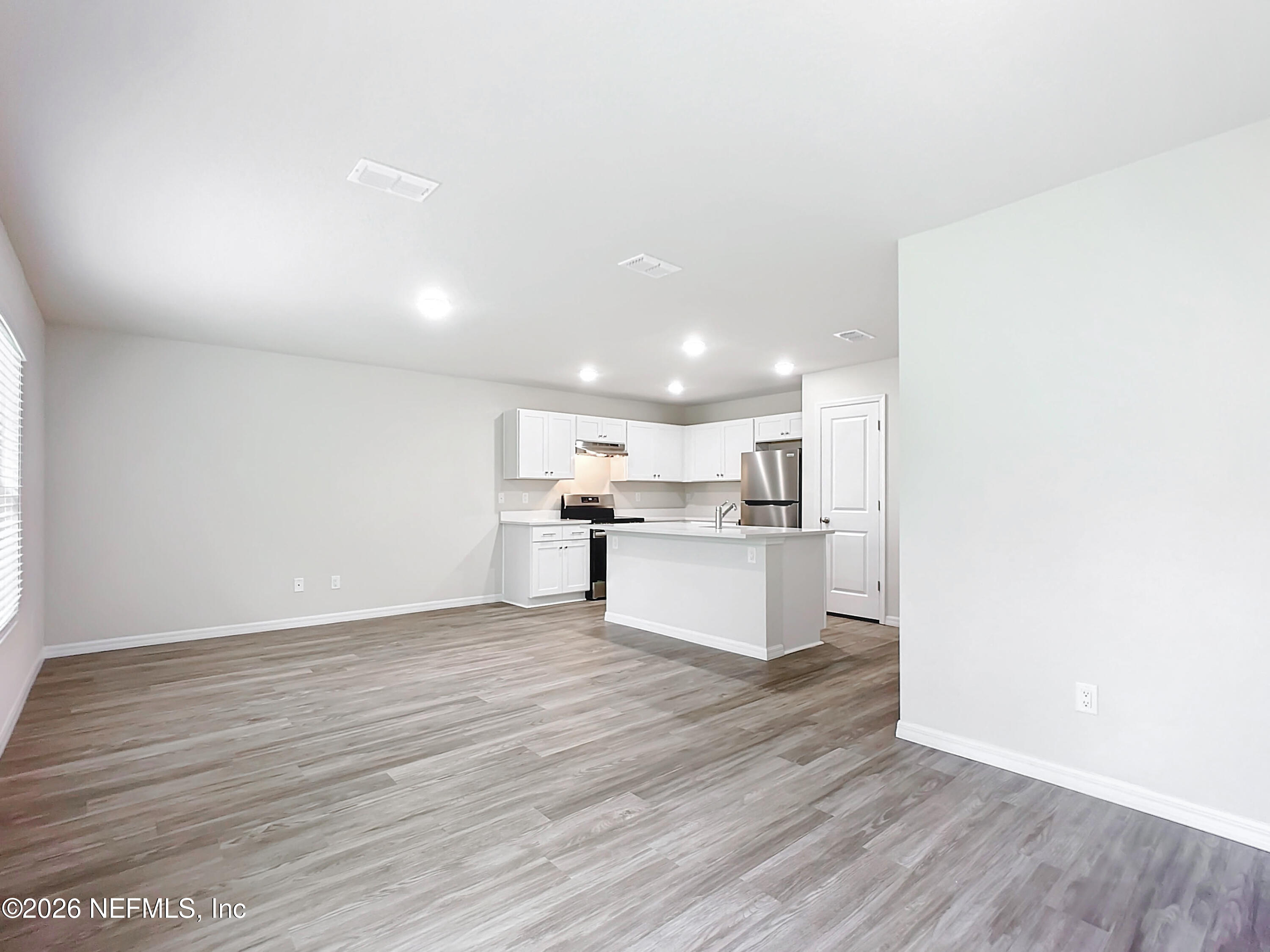 66 Rickenbacker Drive Palm Coast, FL 32164 - Photo 7 of 8 a view of kitchen with wooden floor