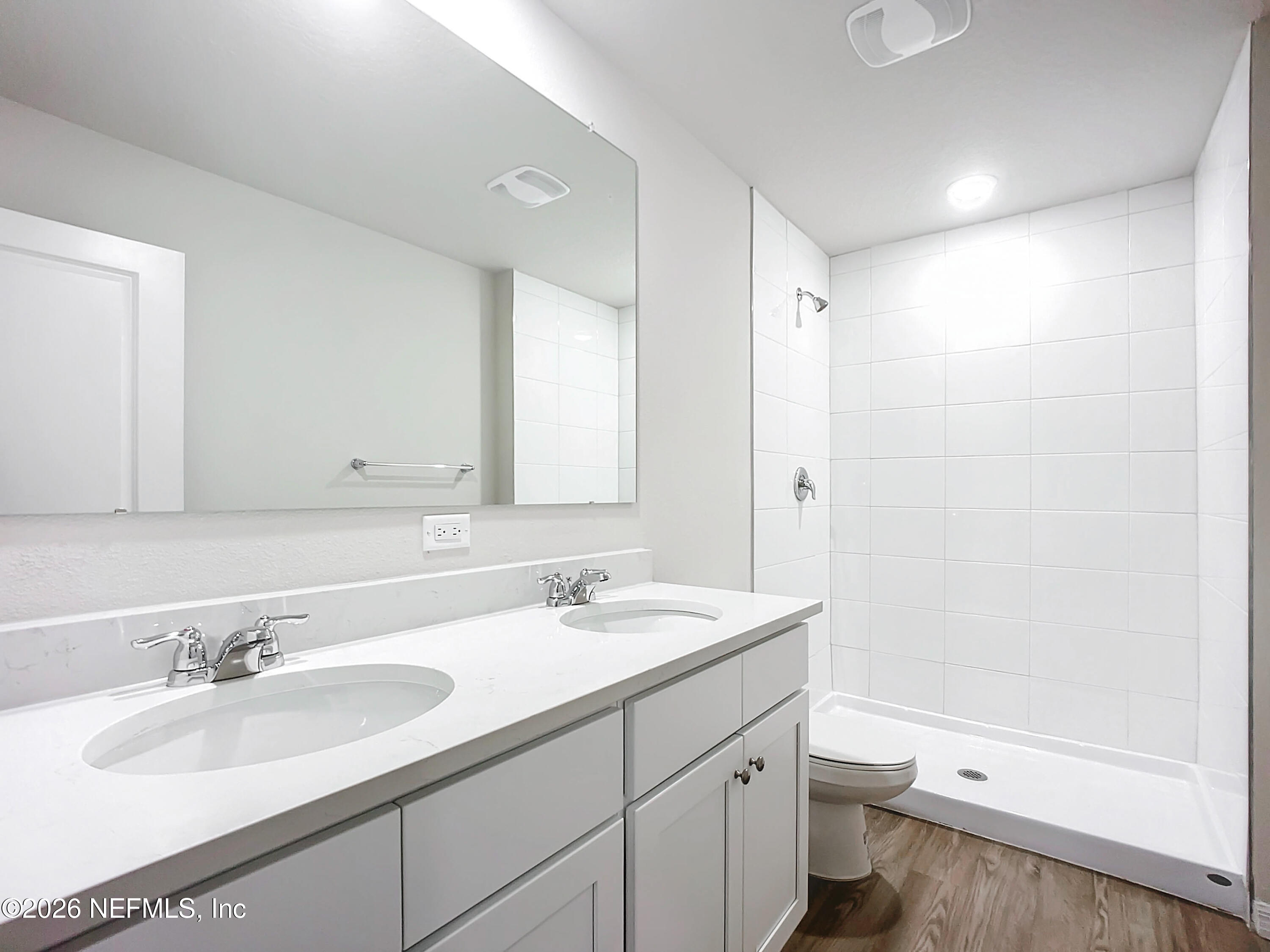 66 Rickenbacker Drive Palm Coast, FL 32164 - Photo 8 of 8 a bathroom with a sink a toilet a tub and a mirror
