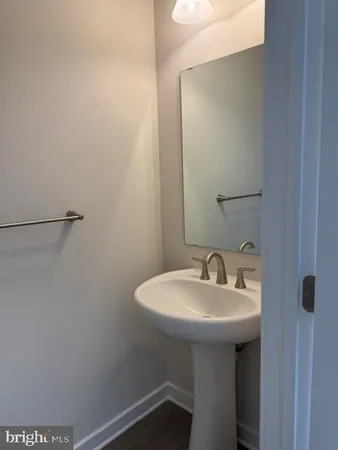 a bathroom with a sink and mirror