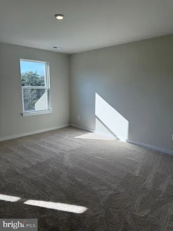 an empty room with a fan