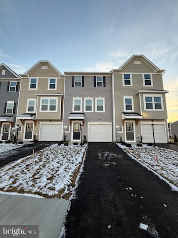 89 Tumblehome Road Inwood, WV 25428 - Photo 2 of 20 a front view of a house with a yard