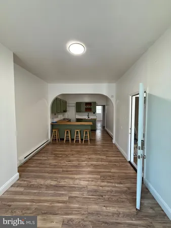 a view of a room with lots of wooden floor