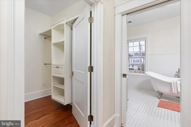 a bathroom with a sink a mirror and a shower
