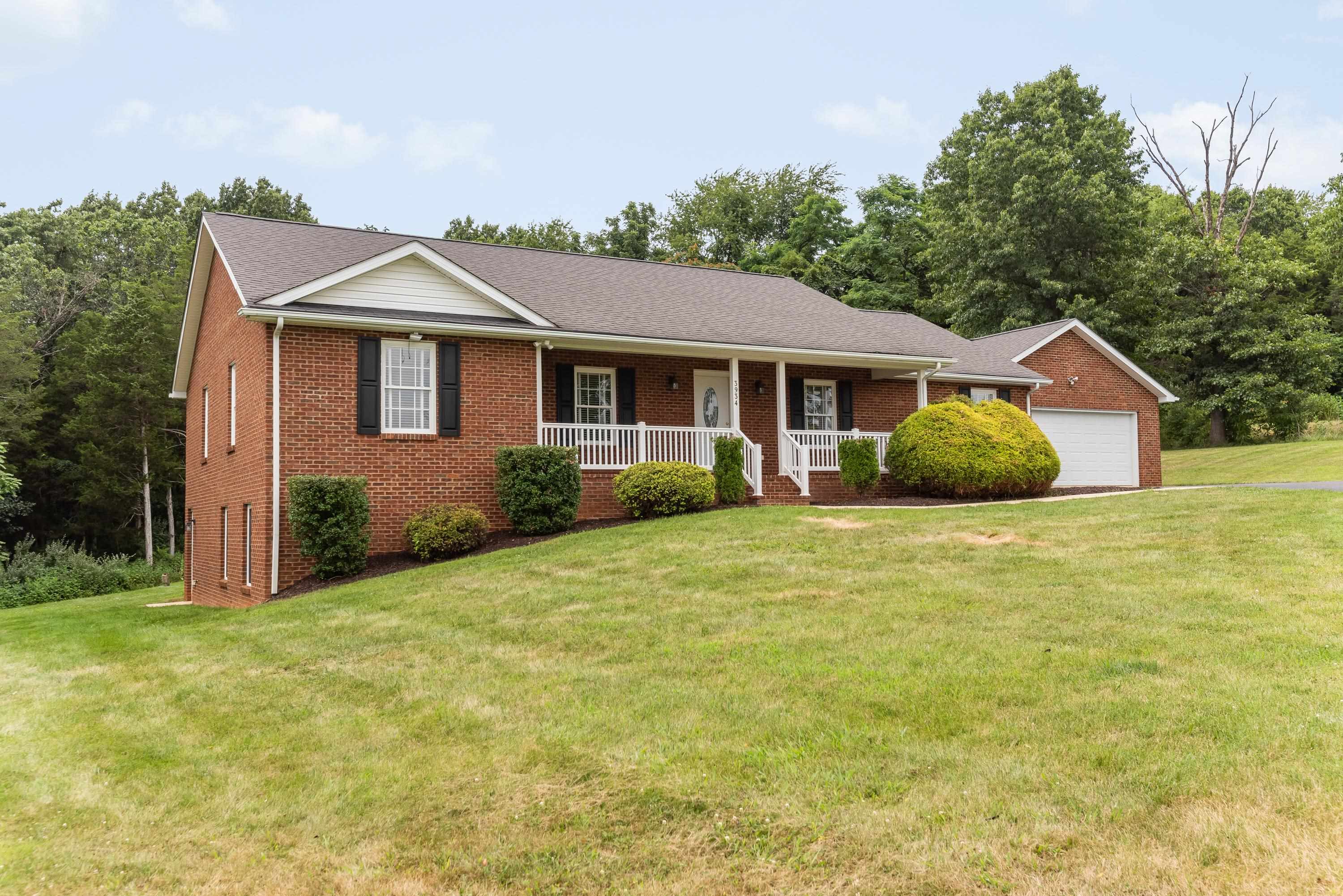 3934 Shutterlee Mill Road Staunton, VA 24401 - Photo 2 of 49 a front view of house with yard and trees around