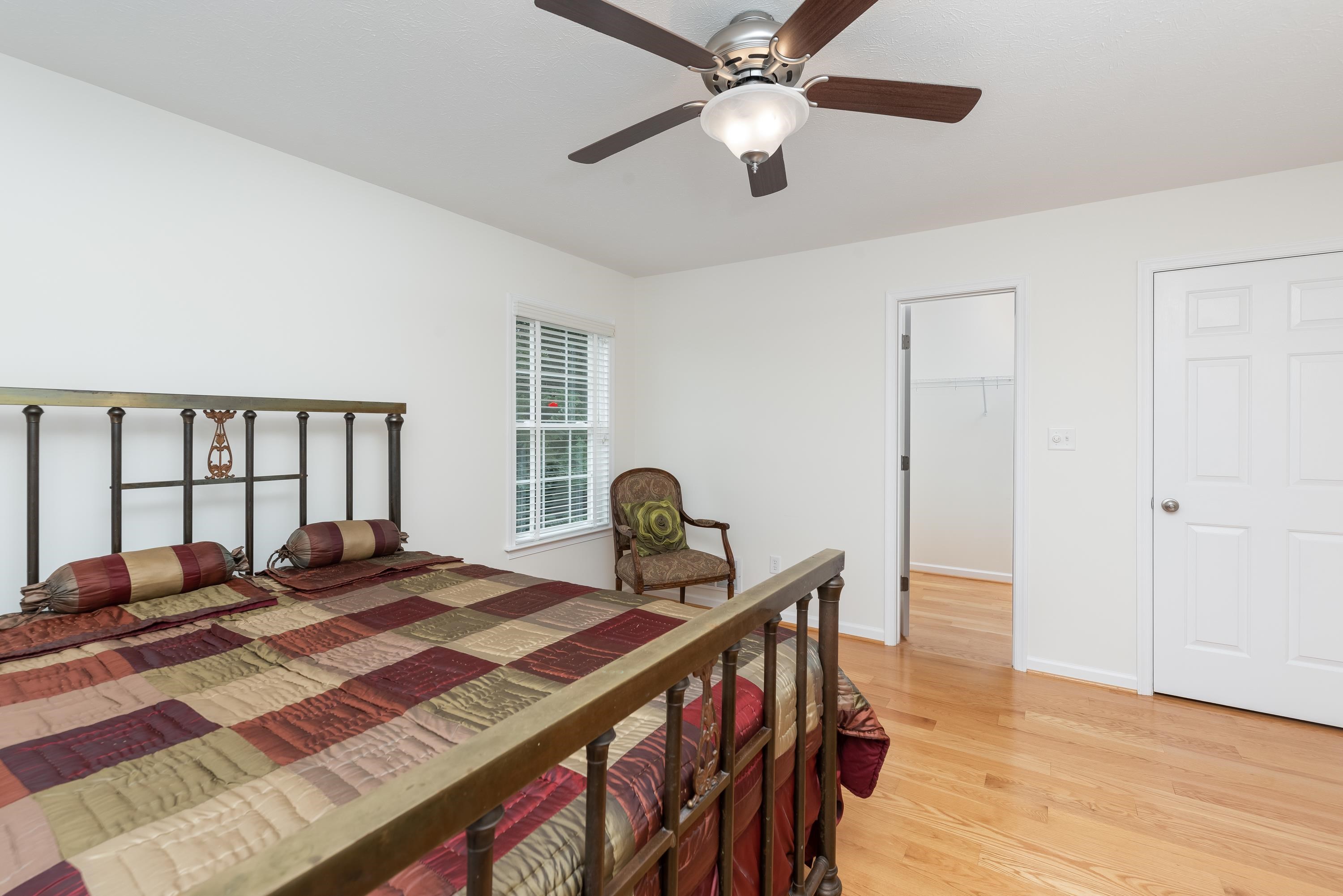 3934 Shutterlee Mill Road Staunton, VA 24401 - Photo 28 of 49 a bedroom with a bed and a large window
