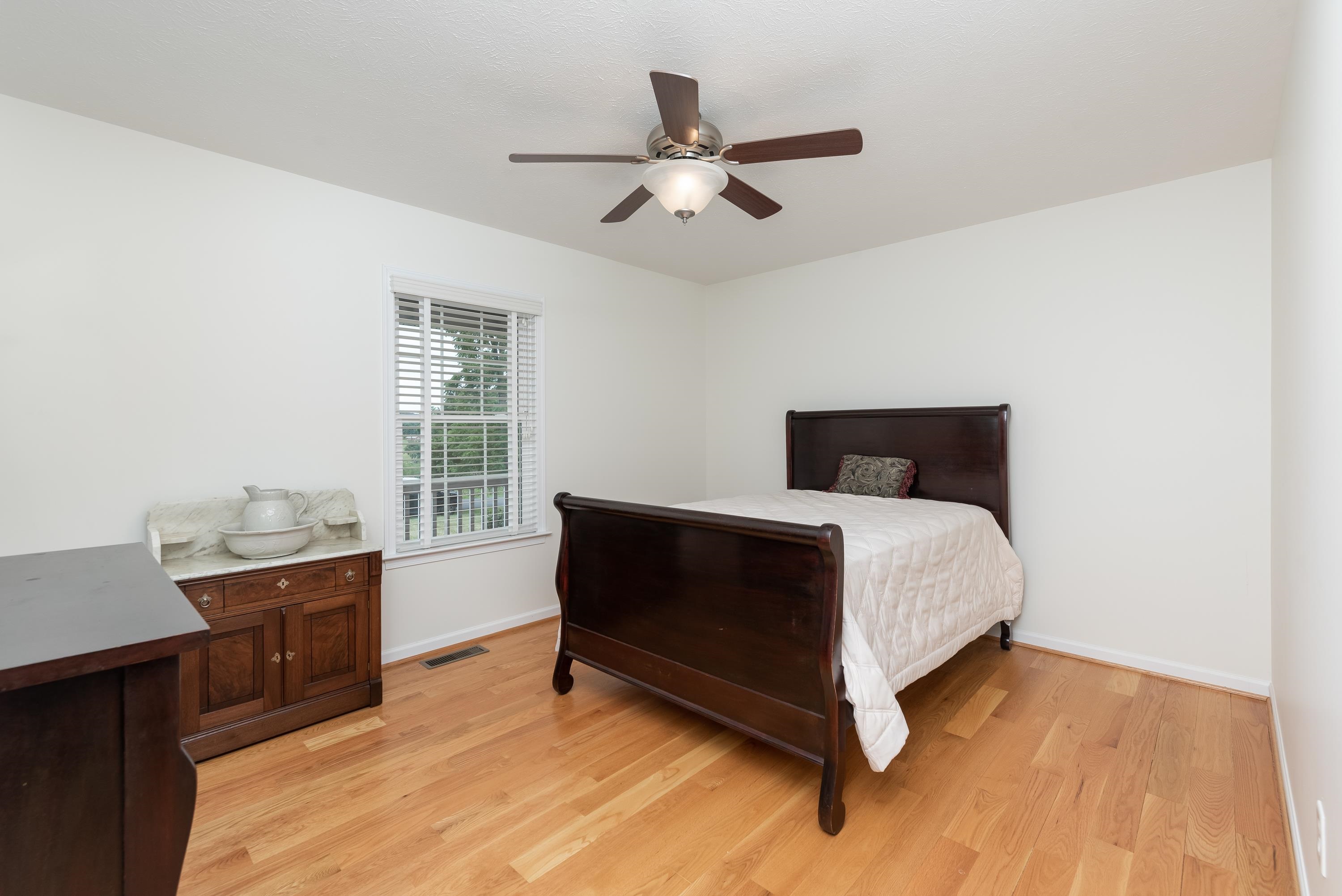 3934 Shutterlee Mill Road Staunton, VA 24401 - Photo 29 of 49 a bedroom with a bed and window