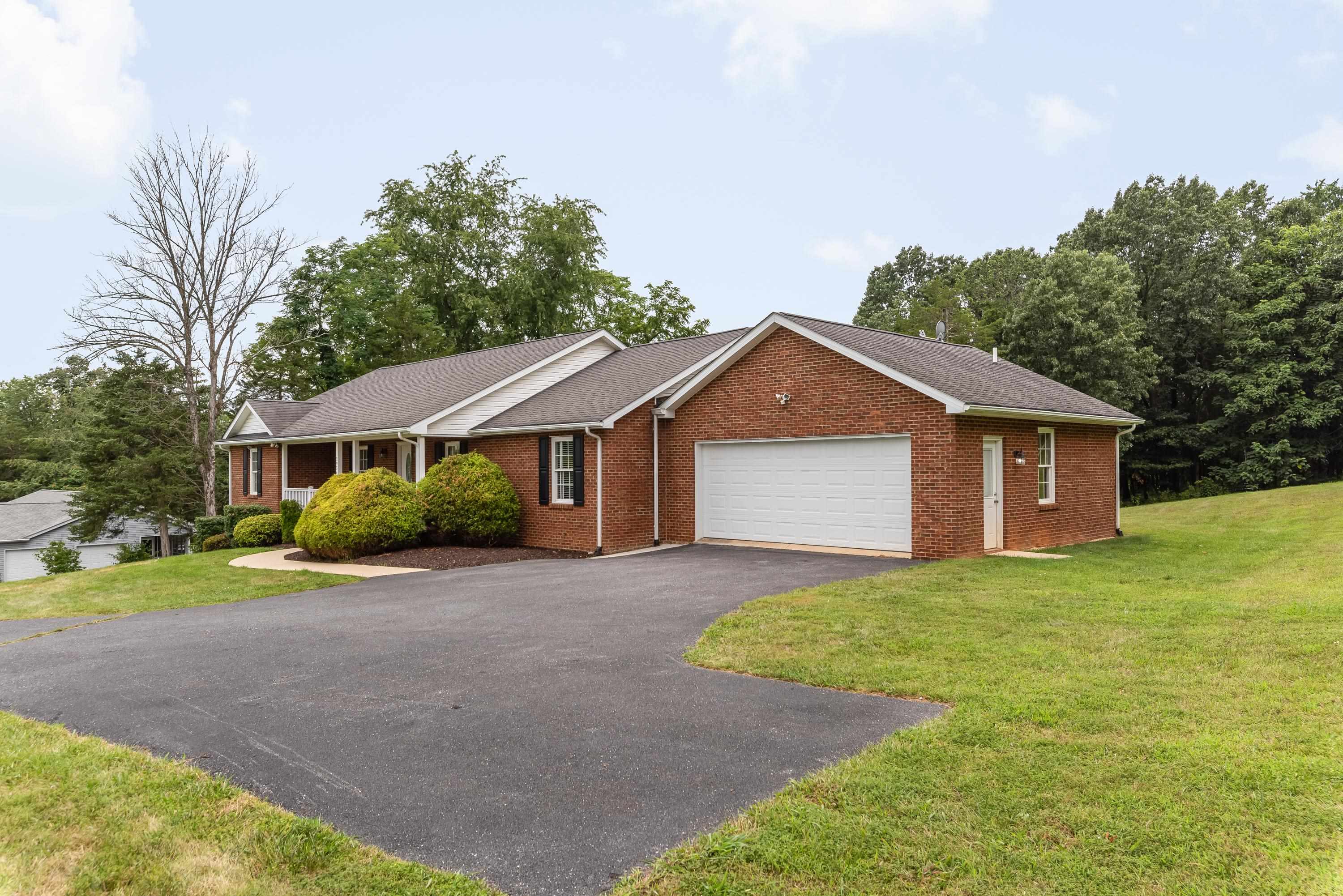 3934 Shutterlee Mill Road Staunton, VA 24401 - Photo 3 of 49 a front view of a house with a yard and garage
