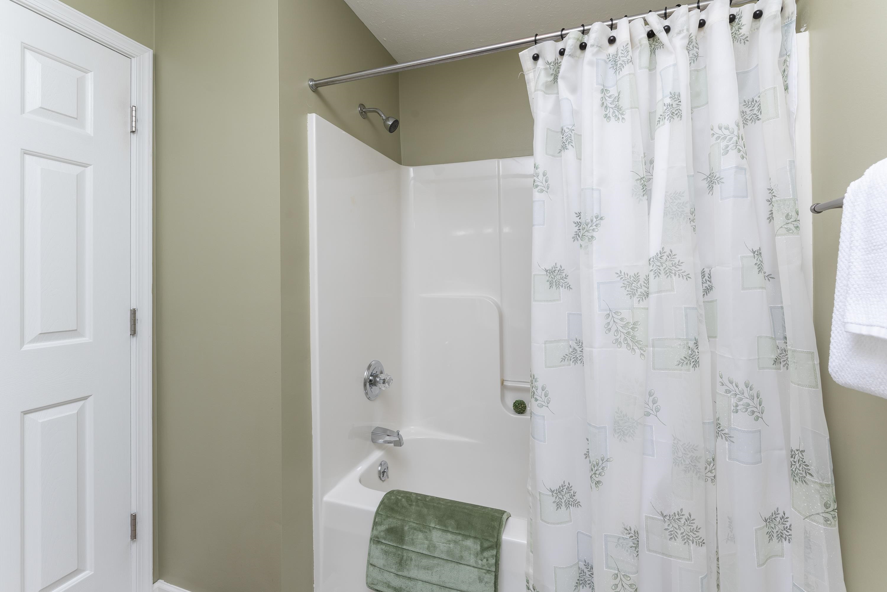 3934 Shutterlee Mill Road Staunton, VA 24401 - Photo 33 of 49 a bathroom with a shower curtain and a sink