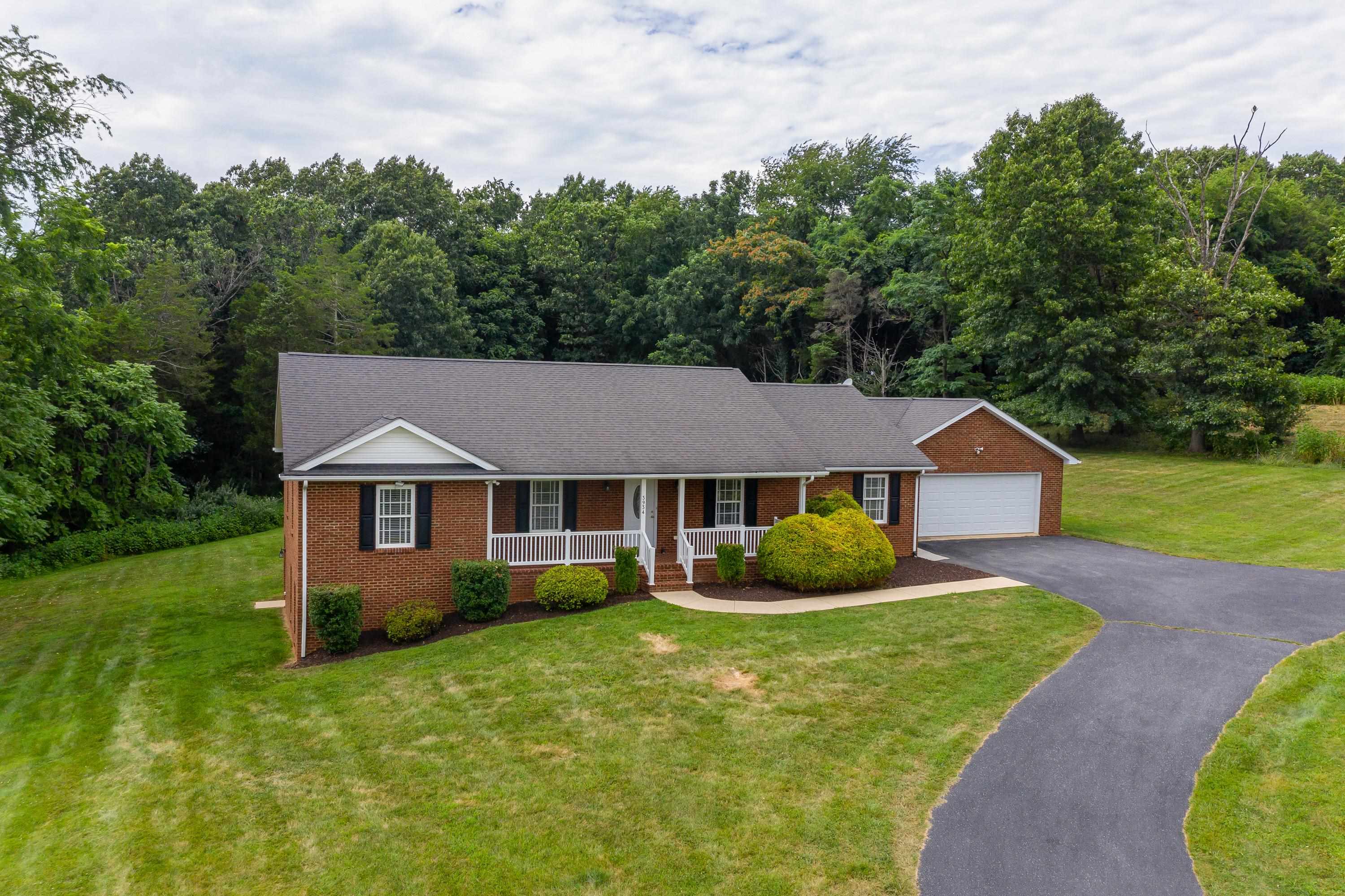 3934 Shutterlee Mill Road Staunton, VA 24401 - Photo 4 of 49 a front view of a house with a yard and trees