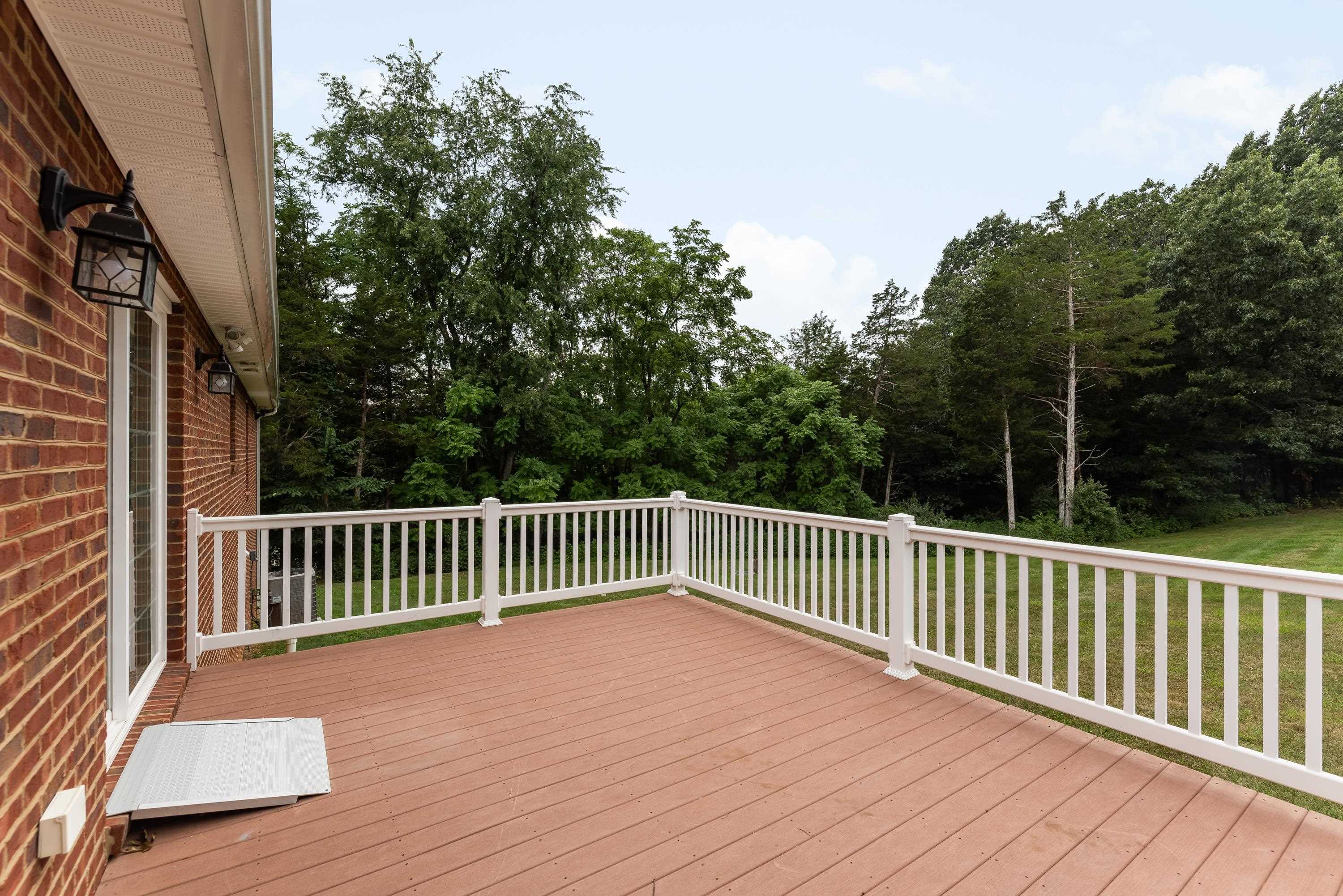 3934 Shutterlee Mill Road Staunton, VA 24401 - Photo 43 of 49 a balcony with wooden floor and fence