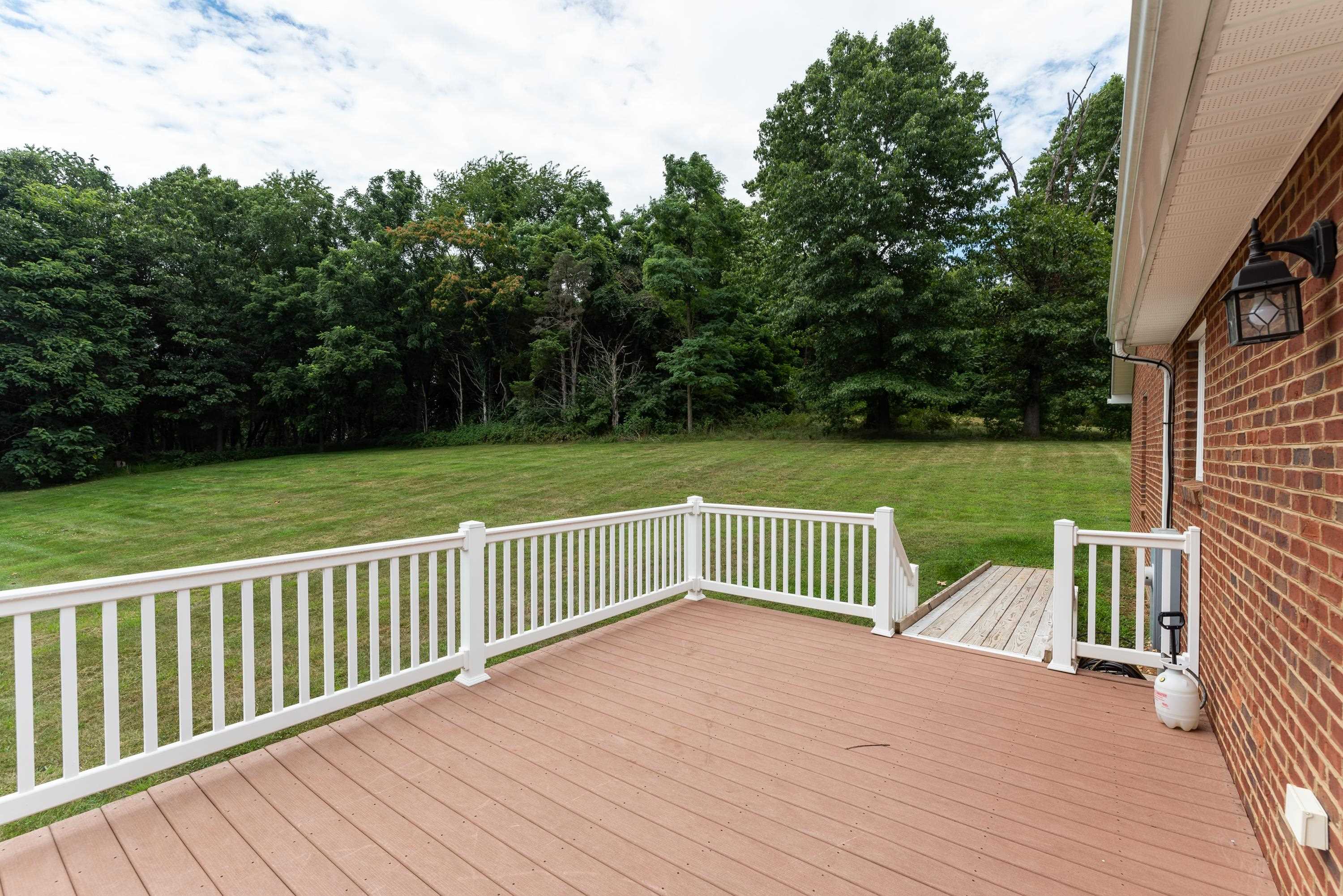 3934 Shutterlee Mill Road Staunton, VA 24401 - Photo 44 of 49 a view of a wooden deck and yard with green space