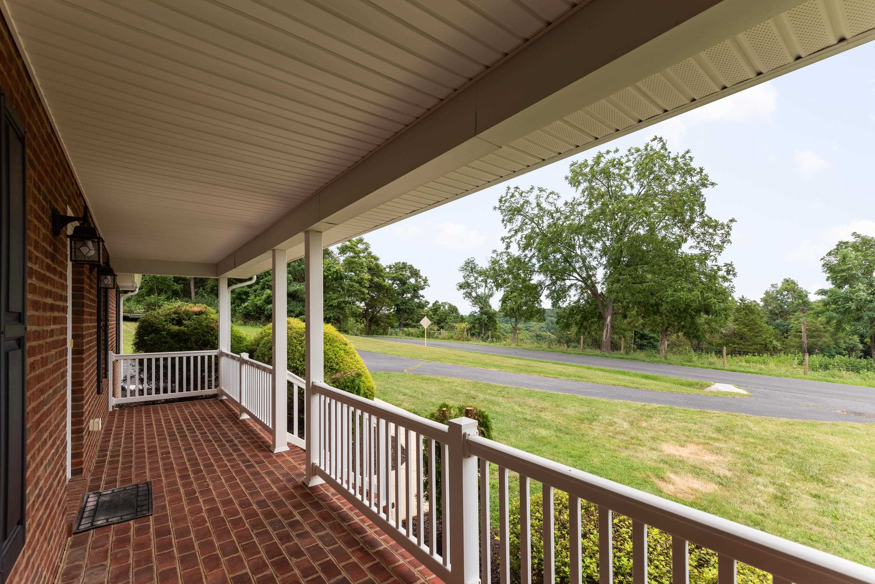 3934 Shutterlee Mill Road Staunton, VA 24401 - Photo 5 of 49 a view of a wooden deck next to a yard