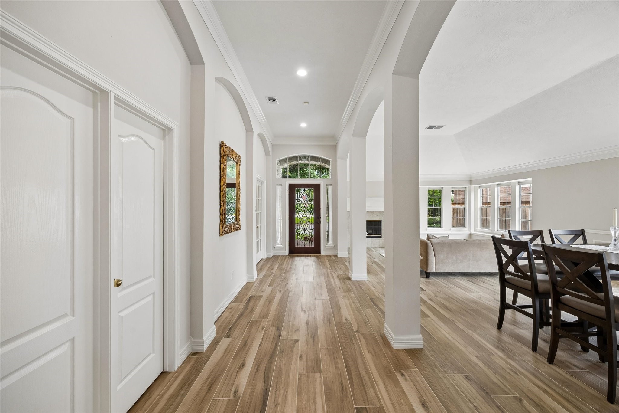 5306 Summerland Ridge Court Houston, TX 77041 - Photo 3 of 33 a view of a dining room with furniture and wooden floor