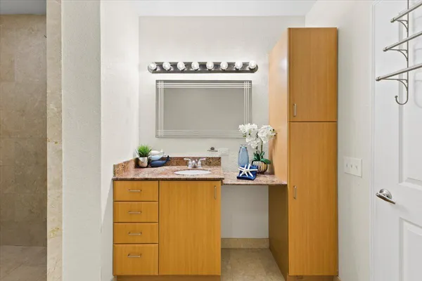 a bathroom with a sink and a mirror