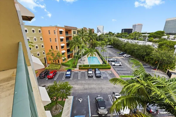 an aerial view of multiple houses with a yard