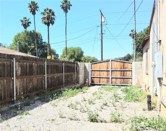 a view of a backyard of the house