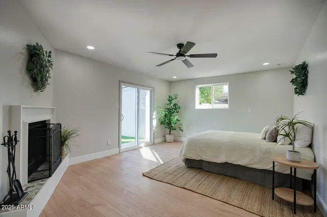 a bedroom with a bed and dresser