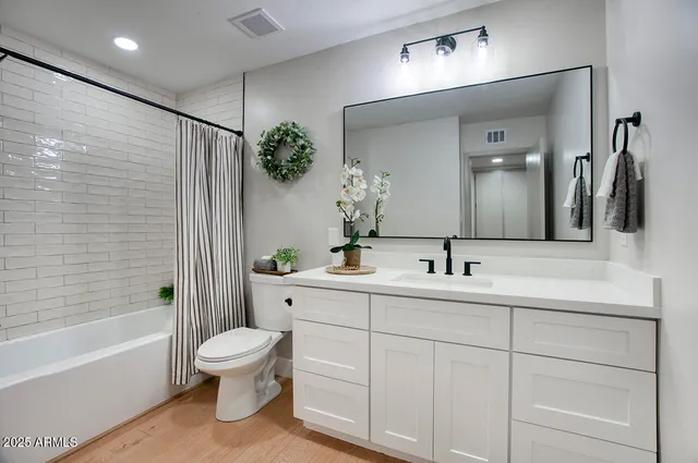 a bathroom with a toilet sink and bathtub