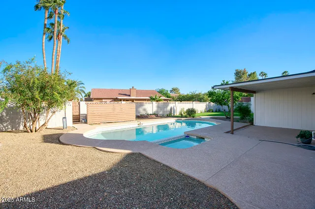 a view of a house with basketball court