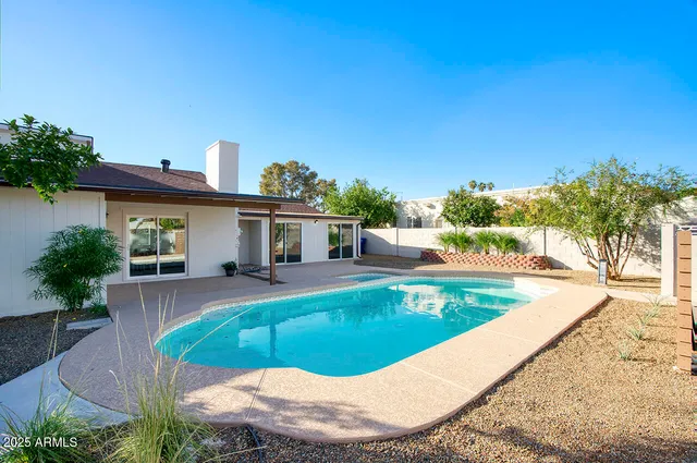 a view of a house with swimming pool