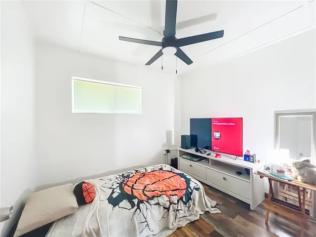 a bathroom with a toilet a sink and shower