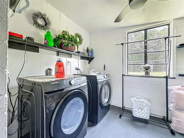 a view of a city with green field