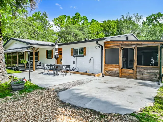 a view of a backyard of the house