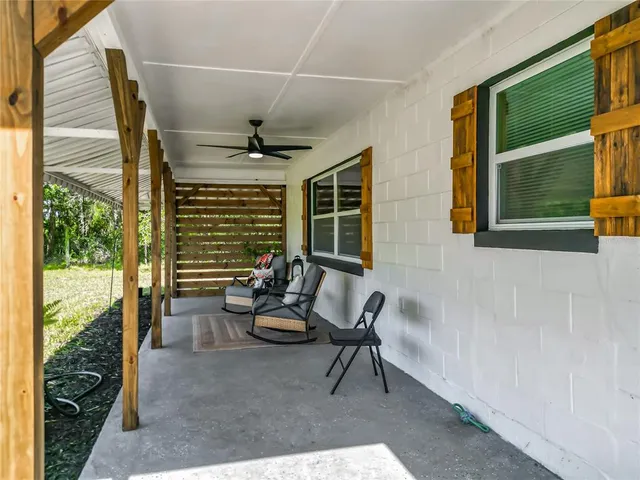 a view of a house with dining area and yard