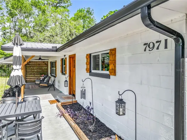 a kitchen with stainless steel appliances a stove a sink and cabinets