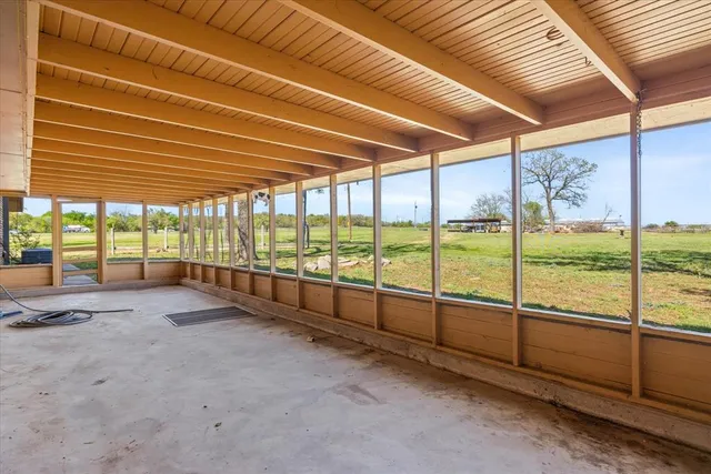 a view of an empty room with a balcony