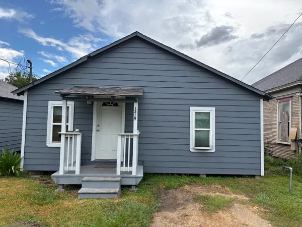 front view of a house with a small yard