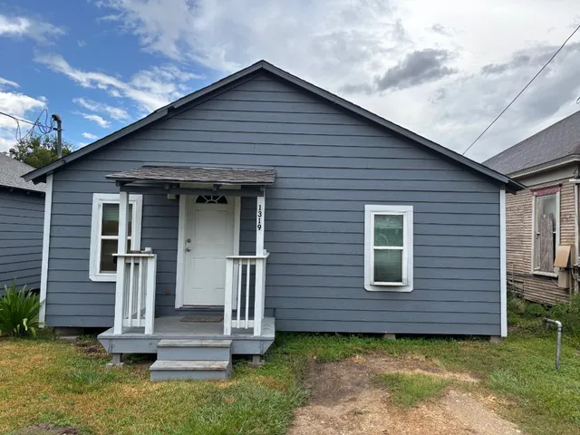front view of a house with a small yard