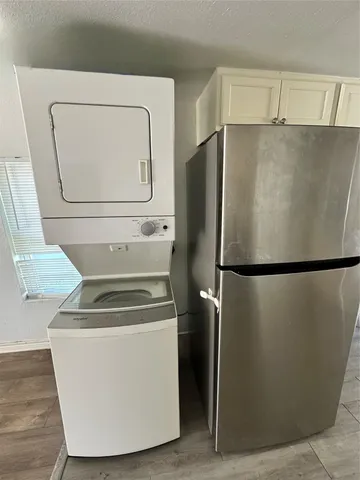 a white refrigerator freezer sitting in a kitchen