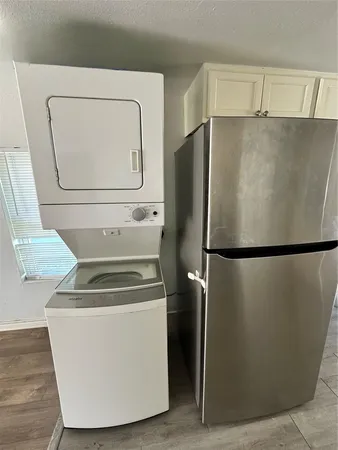 a white refrigerator freezer sitting in a kitchen