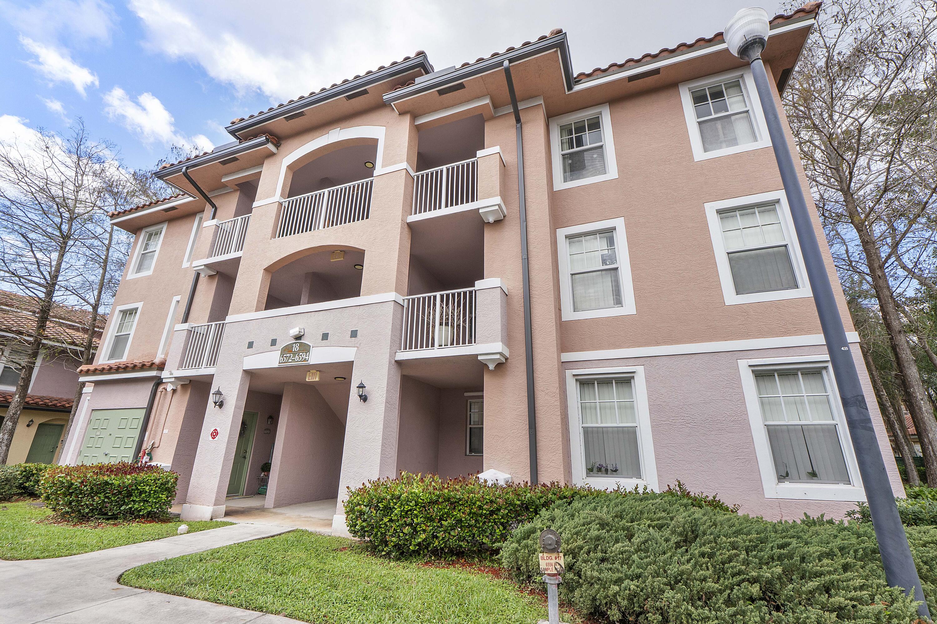 6592 West Sample Road, Unit 6592 Coral Springs, FL 33067 - Photo 1 of 42 front view of a building