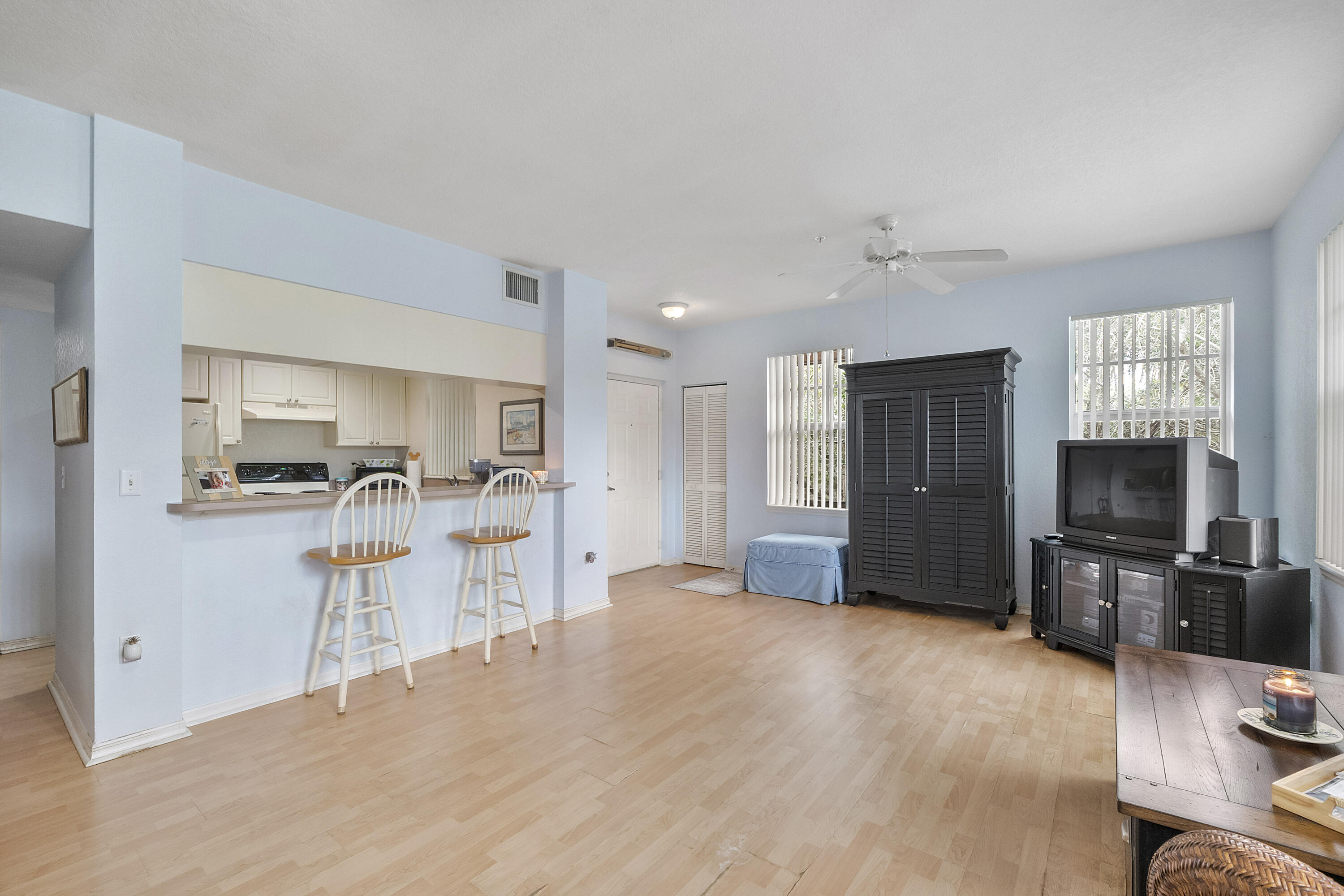 6592 West Sample Road, Unit 6592 Coral Springs, FL 33067 - Photo 11 of 42 a kitchen with a refrigerator and a sink